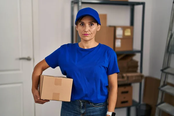 Middle Age Brunette Woman Working Wearing Delivery Uniform Cap Skeptic — Stok fotoğraf