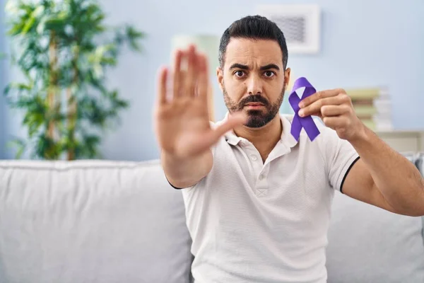 Young Hispanic Man Beard Holding Purple Ribbon Awareness Open Hand — 图库照片
