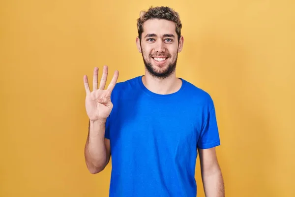 Hispanic Man Beard Standing Yellow Background Showing Pointing Fingers Number — Stockfoto