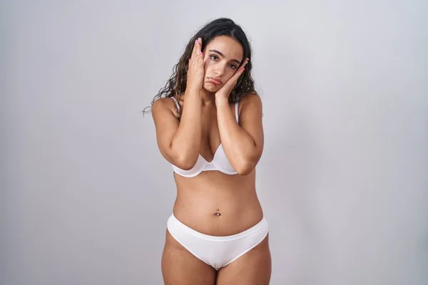 Young Hispanic Woman Wearing White Lingerie Tired Hands Covering Face —  Fotos de Stock