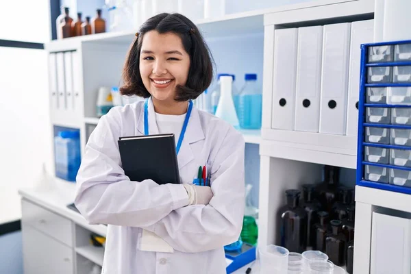 Young Hispanic Woman Working Scientist Laboratory Winking Looking Camera Sexy — Stockfoto