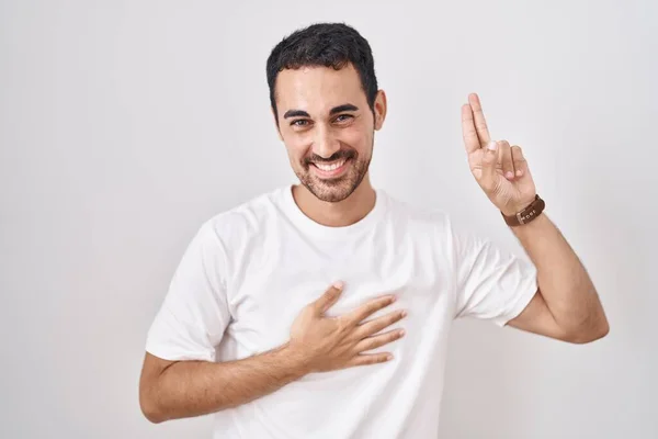 Handsome Hispanic Man Standing White Background Smiling Swearing Hand Chest — Foto de Stock