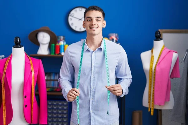 Young Hispanic Man Tailor Smiling Confident Standing Sewing Studio — Stok fotoğraf
