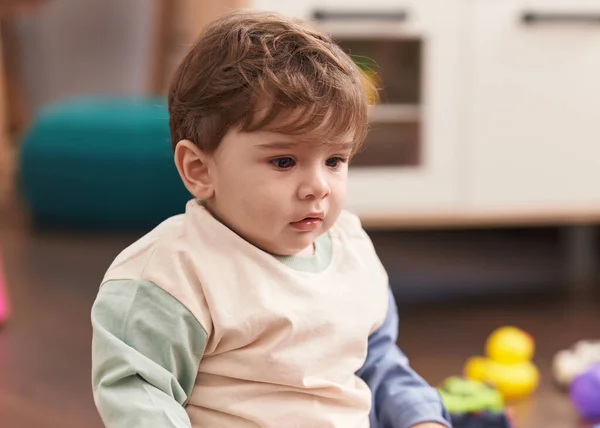 Adorable Hispanic Toddler Sitting Floor Serious Expression Home — Stock Photo, Image