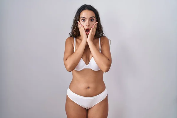 Young Hispanic Woman Wearing White Lingerie Afraid Shocked Surprise Amazed — Zdjęcie stockowe