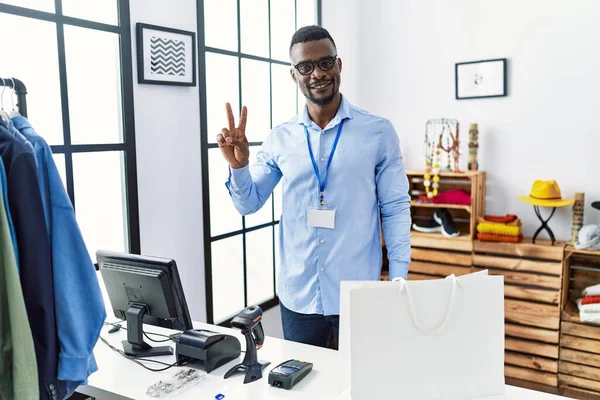 Young African Man Working Manager Retail Boutique Showing Pointing Fingers — Stok fotoğraf