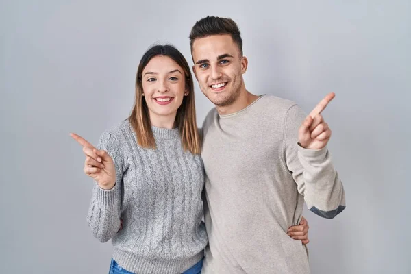 Young Hispanic Couple Standing White Background Big Smile Face Pointing — Stockfoto