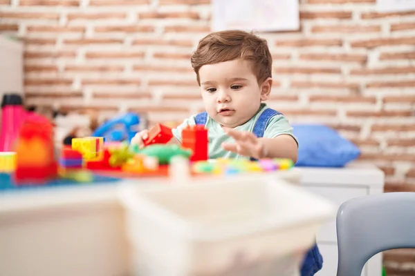 Adorable Hispanic Toddler Playing Construction Blocks Standing Kindergarten — Stock Photo, Image