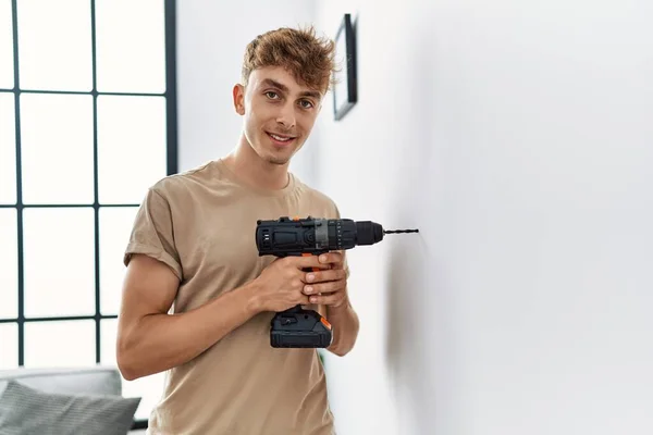 Young Caucasian Man Smiling Confident Drilling Wall Home — Stock Photo, Image