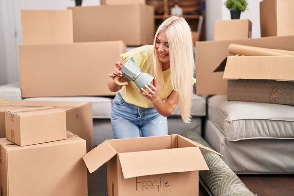 Young Blonde Woman Unpacking Coffeemaker Sitting Floor New Home — Stock Photo, Image