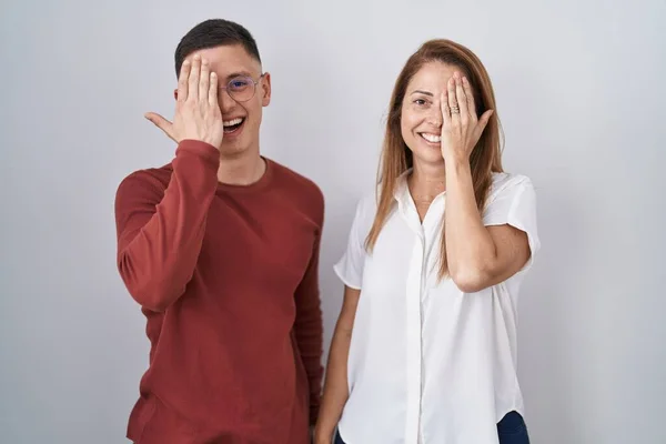 Mother Son Standing Together Isolated Background Covering One Eye Hand — Zdjęcie stockowe