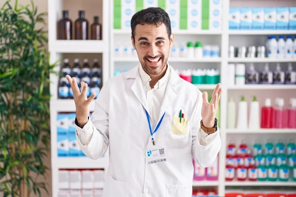 Handsome Hispanic Man Working Pharmacy Drugstore Celebrating Crazy Amazed Success — Zdjęcie stockowe