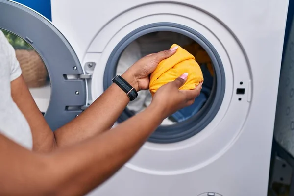 African American Woman Putting Clothes Washing Machine Laundry Room — Zdjęcie stockowe