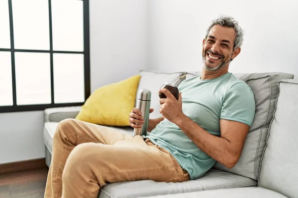 Middle Age Grey Haired Man Drinking Mate Infusion Sitting Sofa — ストック写真