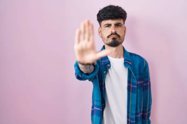 Young Hispanic Man Beard Standing Pink Background Doing Stop Sing —  Fotos de Stock