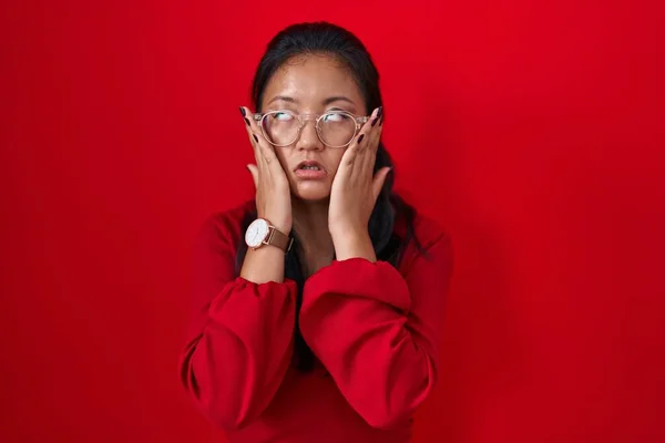 Asian Young Woman Standing Red Background Tired Hands Covering Face —  Fotos de Stock