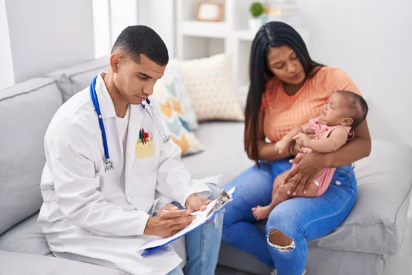 Hispanic Family Having Medic Consultation Writing Document Home — Stok fotoğraf