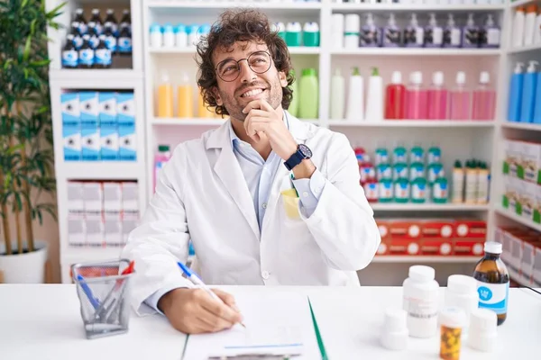 Hispanic Young Man Working Pharmacy Drugstore Hand Chin Thinking Question — Fotografia de Stock