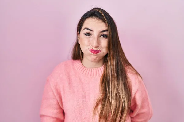 Young Hispanic Woman Standing Pink Background Puffing Cheeks Funny Face — Zdjęcie stockowe