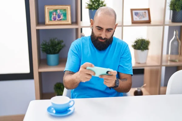 Young Bald Man Playing Video Game Smartphone Home — Stockfoto