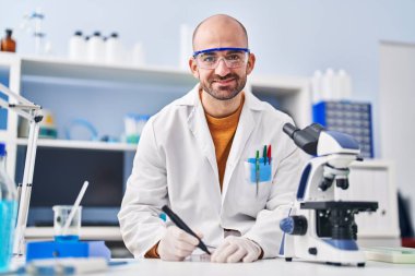 Young man scientist working at laboratory