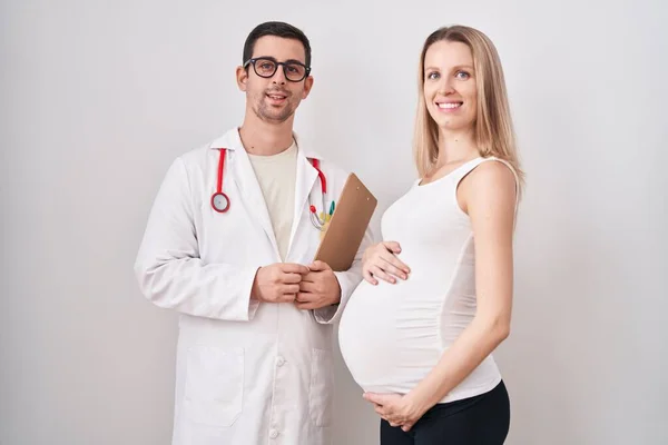 Young Woman Expecting Baby Doctor Looking Positive Happy Standing Smiling — Stock Photo, Image