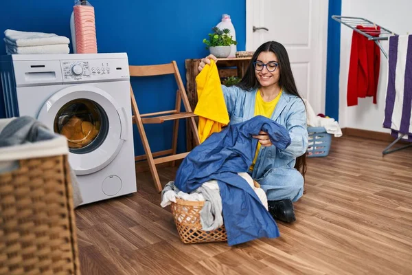 Young Hispanic Woman Holding Towel Washing Clothes Laundry Room — Fotografia de Stock