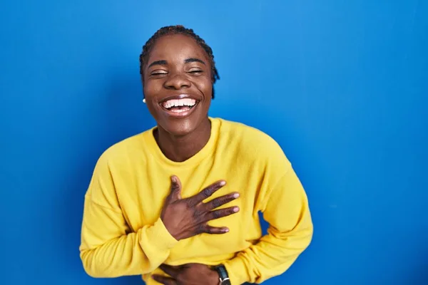 Beautiful Black Woman Standing Blue Background Smiling Laughing Hard Out — Stockfoto