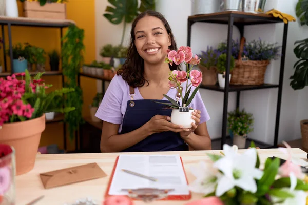 Young African American Woman Florist Smiling Confident Holding Plant Flower — Stock Photo, Image