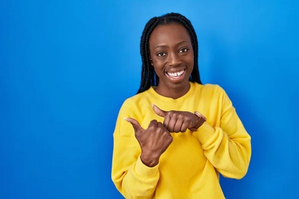 Beautiful Black Woman Standing Blue Background Pointing Back Hand Thumbs — Fotografia de Stock