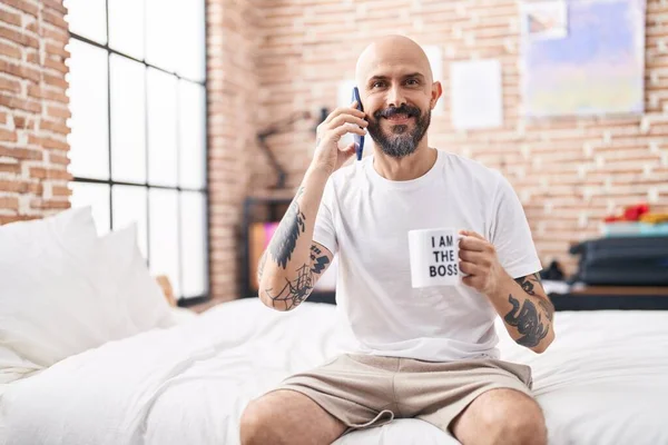Young Bald Man Talking Smartphone Drinking Coffee Bedroom —  Fotos de Stock