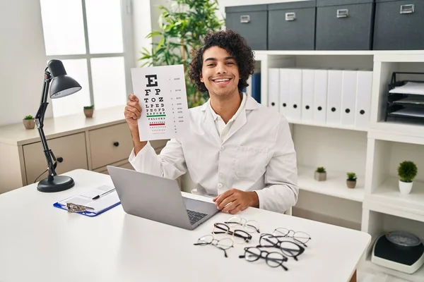Hispanic Man Curly Hair Holding Eyesight Medical Exam Looking Positive — Stockfoto