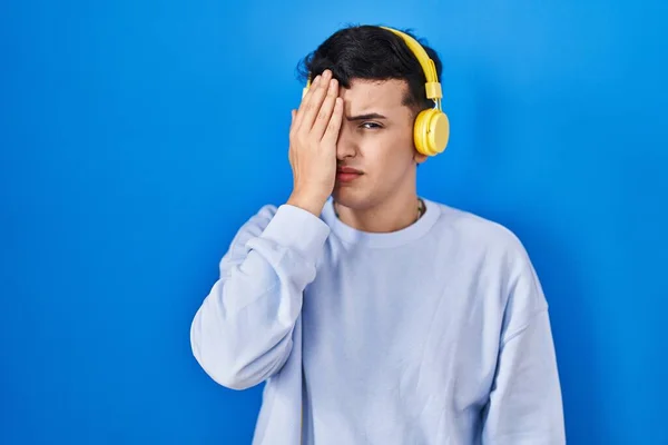 Non Binary Person Listening Music Using Headphones Yawning Tired Covering — Foto de Stock