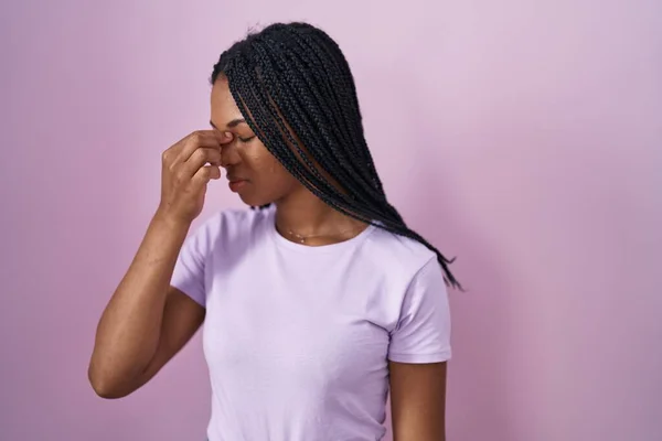 African American Woman Braids Standing Pink Background Tired Rubbing Nose — Stock fotografie