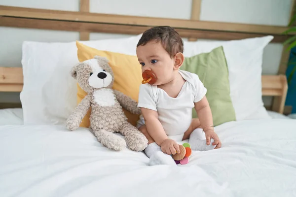 Adorable Hispanic Baby Sucking Pacifier Sitting Bed Bedroom — Stock Photo, Image