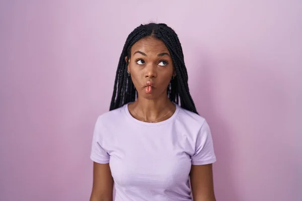 African American Woman Braids Standing Pink Background Making Fish Face — 스톡 사진