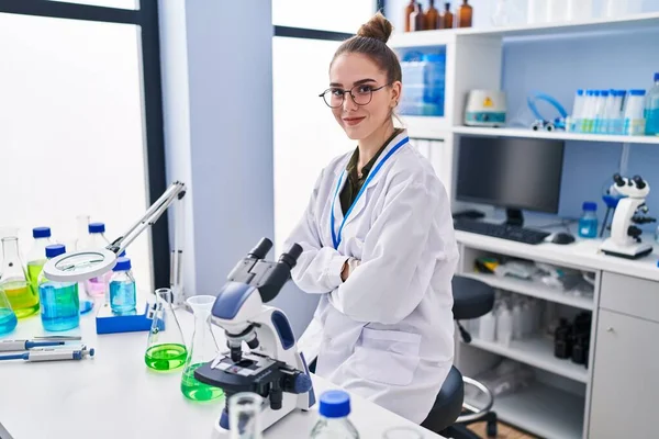 Young Woman Scientist Sitting Arms Crossed Gesture Laboratory — Fotografie, imagine de stoc