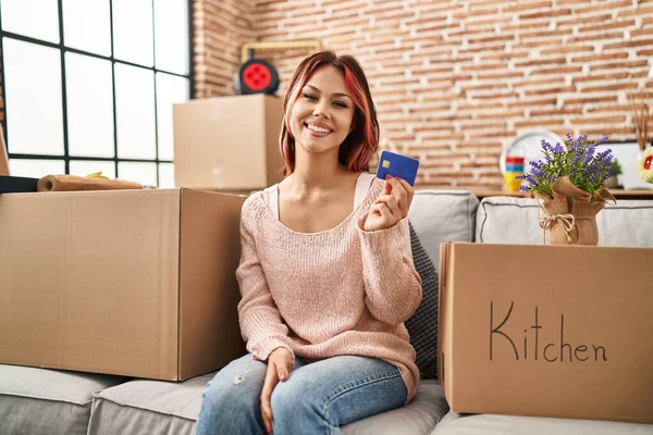 Young Caucasian Woman Moving New Home Holding Credit Card Looking — Foto de Stock