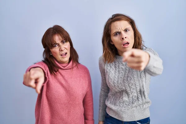Mother Daughter Standing Blue Background Pointing Displeased Frustrated Camera Angry —  Fotos de Stock