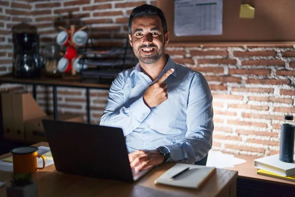 Hispanic Man Beard Working Office Night Cheerful Smile Face Pointing — стоковое фото
