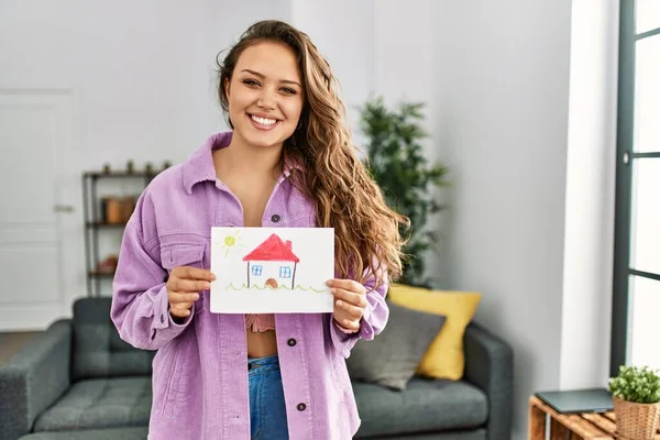 Young Beautiful Hispanic Woman Smiling Confident Holding House Draw Home — Stockfoto