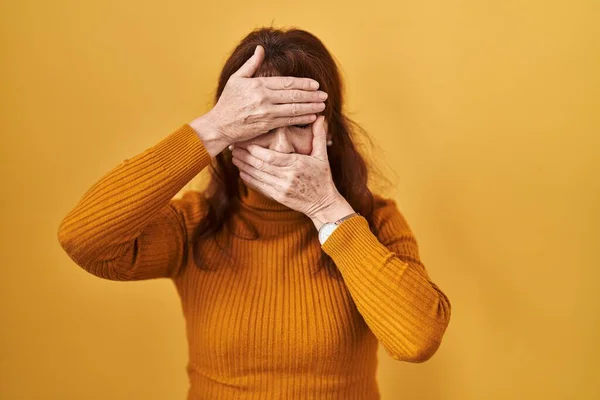 Middle Age Hispanic Woman Standing Yellow Background Covering Eyes Mouth — Photo