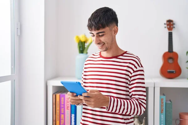 Young Hispanic Man Using Touchpad Standing Bedroom — Foto de Stock