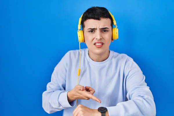 Non Binary Person Listening Music Using Headphones Hurry Pointing Watch — Stockfoto