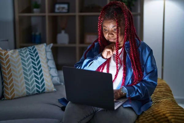 African American Woman Braided Hair Using Computer Laptop Night Looking —  Fotos de Stock