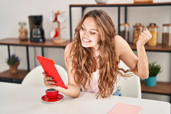 Young Hispanic Woman Doing Video Call Tablet Screaming Proud Celebrating — стоковое фото