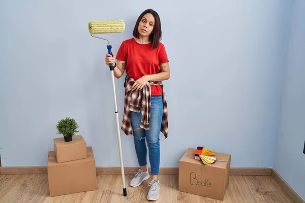 Young Hispanic Woman Painting Home Walls Paint Roller Looking Sleepy — Stock Photo, Image
