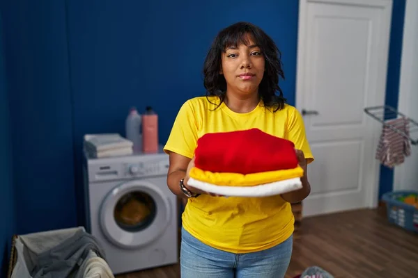 Hispanic Woman Holding Clean Laundry Relaxed Serious Expression Face Simple — Stock Photo, Image
