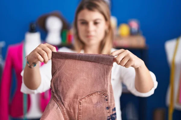 Young Woman Tailor Holding Jeans Sewing Studio — Stock Photo, Image