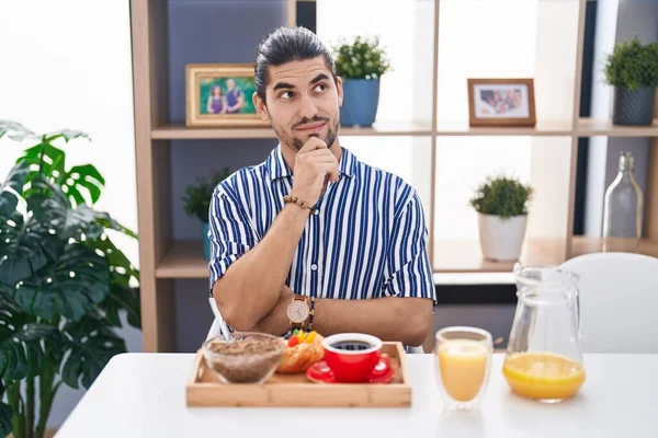 Hispanic Man Long Hair Sitting Table Having Breakfast Serious Face — 图库照片